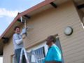 Dwayne and Lassy installing a mesh node