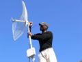 Nana installaling an antenna at the Acts hospice Legogote